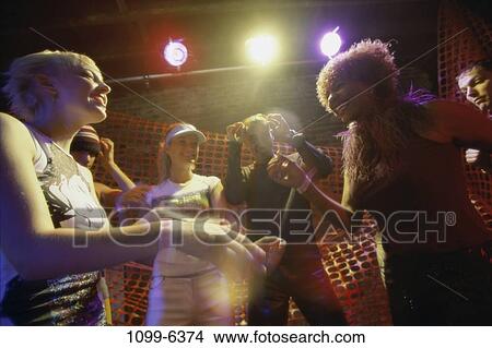 Picture - people, dancing, dance, nightlife, teens, indoors. Fotosearch
