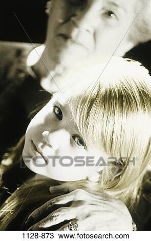 Stock Image - people, depression, serious, sad, protective, protecting, grandchild. Fotosearch
