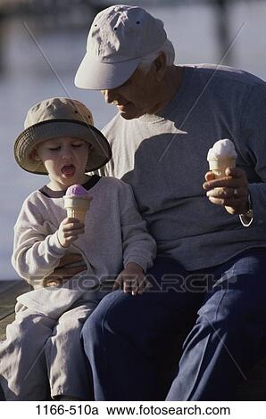 people, eating, licking, hats, sitting, ice cream, outdoors View Large Photo Image Stock Image - people, eating, licking, hats, sitting, ice cream, outdoors. Fotosearch