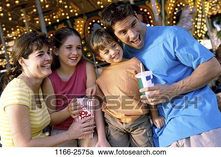 people, eating, smiling, popcorn, watch, drinking, outdoors View Large Photo Image Stock Image - people, eating, smiling, popcorn, watch, drinking, outdoors. Fotosearch