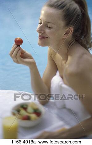 Stock Image - people, eating, woman, morning, healthy, fruit, breakfast. Fotosearch