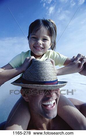 Stock Photo - people, eyes, hat, beach, riding, covering, carrying. Fotosearch