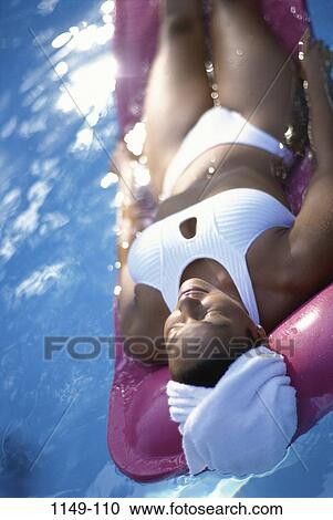 people, floating, woman, lifestyles, outdoors, tranquility, relaxing View Large Photo Image Stock Image - people, floating, woman, lifestyles, outdoors, tranquility, relaxing. Fotosearch