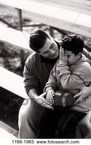 people, football, outdoors, nurturing, family, comforting View Large Photo Image Stock Image - people, football, outdoors, nurturing, family, comforting. Fotosearch