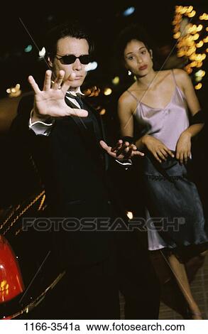 Stock Image - people, formal, limousine, couple, guard, outdoors, serious. Fotosearch