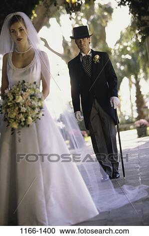 people, formal, walking, couple, outdoors, wedding, bouquet View Large Photo Image Stock Image - people, formal, walking, couple, outdoors, wedding, bouquet. Fotosearch