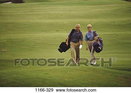 people, green, playing, walking, golf, couple, senior View Large Photo Image Stock Photo - people, green, playing, walking, golf, couple, senior. Fotosearch