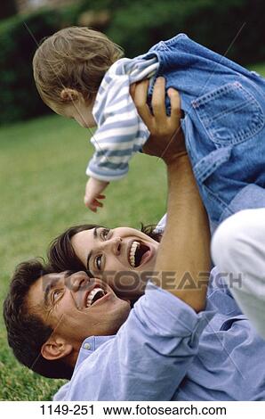 people, ground, toddler, holding, outdoors, joyous, family View Large Photo Image Stock Image - people, ground, toddler, holding, outdoors, joyous, family. Fotosearch