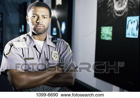 people, guard, serious, security, indoors View Large Photo Image Stock Image - people, guard, serious, security, indoors. Fotosearch
