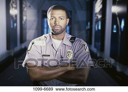 Stock Photo - people, guard, serious, security, indoors. Fotosearch