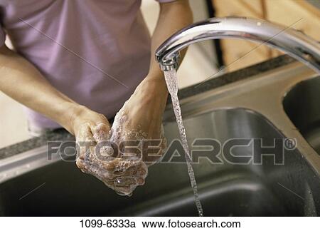 Stock Image - people, hands, water, woman, Asian, spraying. Fotosearch
