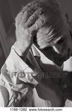 Stock Image - people, headache, gray, depression, senior, patient. Fotosearch