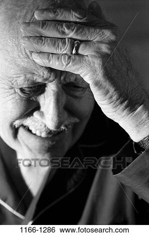 Stock Photograph - people, headache, senior, holding, pain, illness. Fotosearch