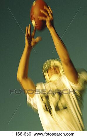 people, Hispanic, football, catching, motion, outdoors View Large Photo Image Stock Photograph - people, Hispanic, football, catching, motion, outdoors. Fotosearch