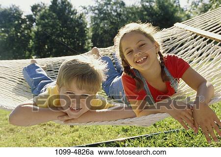 people, Hispanic, hammock, summer, outdoors, relaxing, children View Large Photo Image Stock Image - people, Hispanic, hammock, summer, outdoors, relaxing, children. Fotosearch