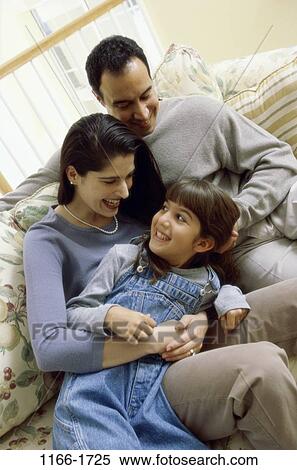 people, home, smiling, Hispanic, couch, playful, hugging View Large Photo Image Stock Photography - people, home, smiling, Hispanic, couch, playful, hugging. Fotosearch