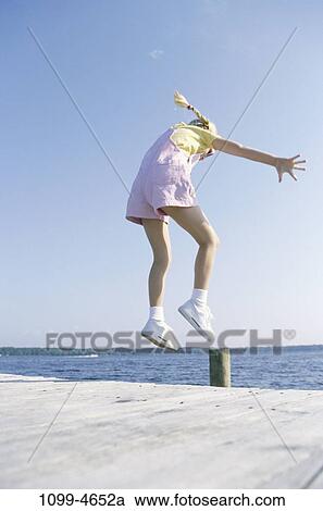 people, jump, jumping, lake, girl, outdoors, adventurous View Large Photo Image Stock Image - people, jump, jumping, lake, girl, outdoors, adventurous. Fotosearch