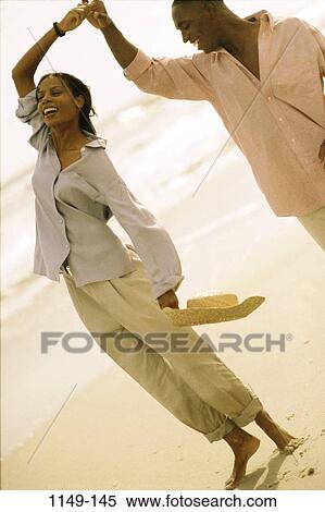 people, jumping, couple, friendship, happy, beach, laughing View Large Photo Image Stock Photography - people, jumping, couple, friendship, happy, beach, laughing. Fotosearch