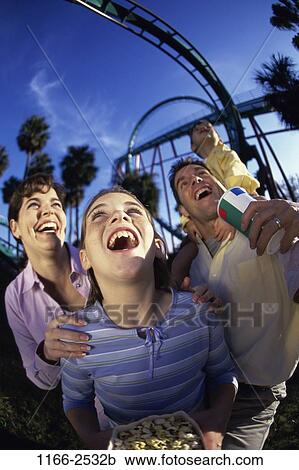 people, laughing, holding, trees, outdoors, park, carrying View Large Photo Image Stock Image - people, laughing, holding, trees, outdoors, park, carrying. Fotosearch