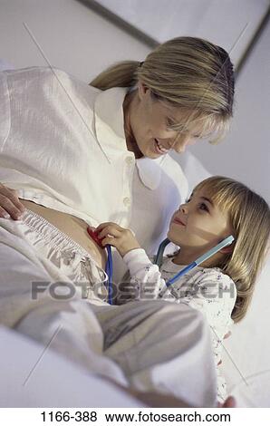 people, listening, mother, stomach, stethoscope, curious, family View Large Photo Image Stock Photo - people, listening, mother, stomach, stethoscope, curious, family. Fotosearch