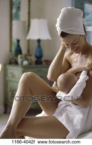 Stock Image - people, mother, baby, family, parent, indoors, Mother baby indoors. Fotosearch