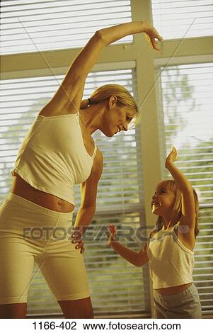 Stock Image - people, mother, healthy, stretching, health, exercise, family. Fotosearch