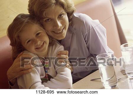 people, mother, hugging, restaurant, commitment, unity, booth View Large Photo Image Stock Photography - people, mother, hugging, restaurant, commitment, unity, booth. Fotosearch