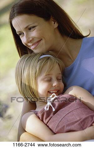 people, mother, outdoors, tranquility, hugging, contemplation, commitment View Large Photo Image Picture - people, mother, outdoors, tranquility, hugging, contemplation, commitment. Fotosearch