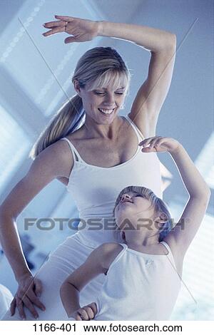 Stock Image - people, mother, stretching, health, exercise, family, blond. Fotosearch
