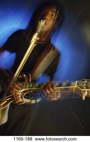 people, music, guitar, motion, entertainment, singing View Large Photo Image Stock Photo - people, music, guitar, motion, entertainment, singing. Fotosearch