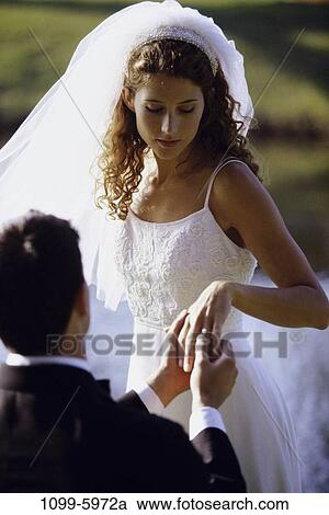 people, outdoors, commitment, ring, wedding, bride, groom View Large Photo Image Stock Image - people, outdoors, commitment, ring, wedding, bride, groom. Fotosearch