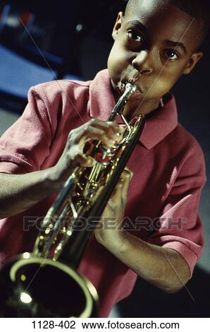 people, playing, horn, music, boy, blowing, serious View Large Photo Image Stock Image - people, playing, horn, music, boy, blowing, serious. Fotosearch