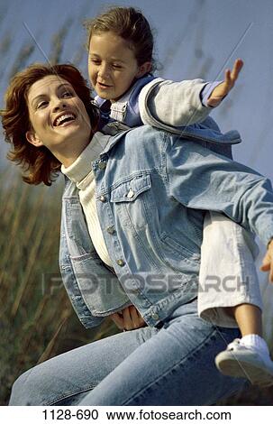 people, playing, mother, flying, stretching, outdoors, carrying View Large Photo Image Stock Image - people, playing, mother, flying, stretching, outdoors, carrying. Fotosearch