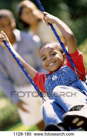 people, playing, swinging, swing, playful, outdoors, family View Large Photo Image Stock Photography - people, playing, swinging, swing, playful, outdoors, family. Fotosearch