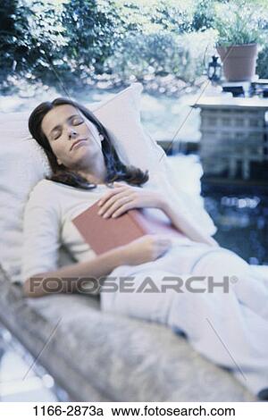 people, relaxation, woman, sleeping, book, outdoors, relaxing View Large Photo Image Stock Image - people, relaxation, woman, sleeping, book, outdoors, relaxing. Fotosearch