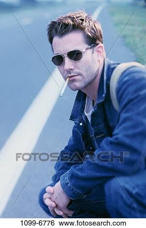 people, road, smoke, cigarette, sunglasses, outdoors View Large Photo Image Stock Photograph - people, road, smoke, cigarette, sunglasses, outdoors. Fotosearch
