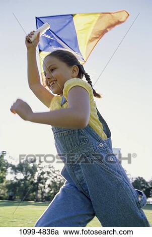 Stock Image - people, running, Hispanic, flying, youth, girl, summer. Fotosearch