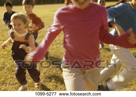 Stock Photo - people, running, outdoors, children, Caucasian, run, kids. Fotosearch