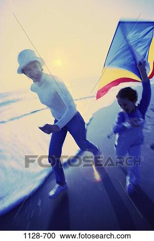 Stock Image - people, running, playing, mother, flying, beach, outdoors. Fotosearch
