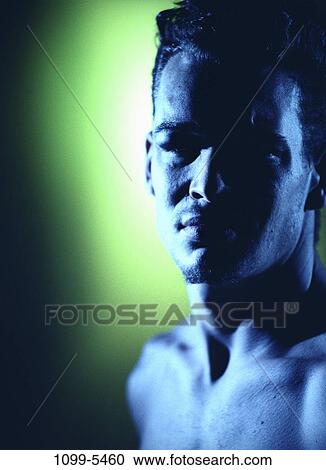 Stock Image - people, shadow, indoors, shadowed, headshot, young adult. Fotosearch