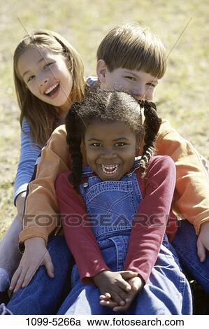 Stock Image - people, sitting, happy, laughing, leaning, outdoors, friends. Fotosearch