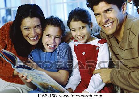 people, sitting, Hispanic, reading, couch, book, family View Large Photo Image Stock Photo - people, sitting, Hispanic, reading, couch, book, family. Fotosearch