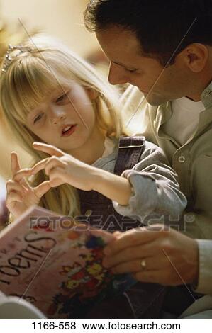 people, sitting, reading, book, fingers, family, father View Large Photo Image Stock Photo - people, sitting, reading, book, fingers, family, father. Fotosearch
