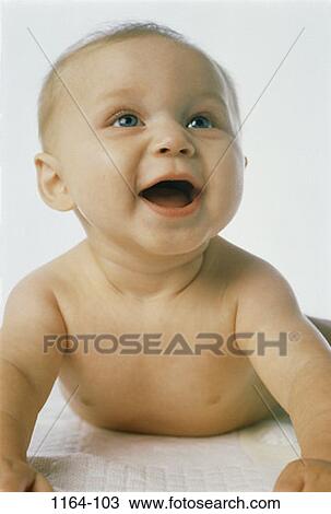people, smiling, baby, propped, smile, laying, amazed View Large Photo Image Stock Image - people, smiling, baby, propped, smile, laying, amazed. Fotosearch
