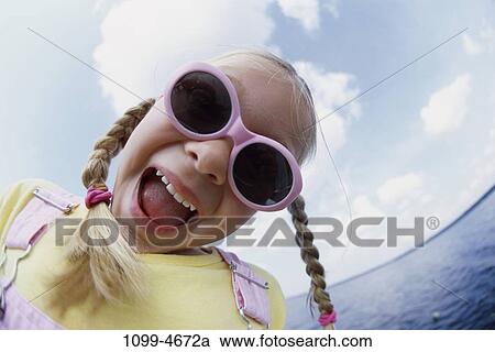 people, smiling, beach, sunglasses, girl, outdoors View Large Photo Image Stock Image - people, smiling, beach, sunglasses, girl, outdoors. Fotosearch