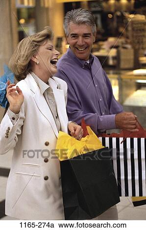 people, smiling, couple, excited, laughing, outdoors, Middle-aged View Large Photo Image Stock Image - people, smiling, couple, excited, laughing, outdoors, Middle-aged. Fotosearch