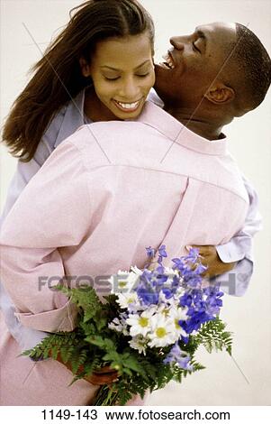 people, smiling, couple, laughing, flowers, lifestyles, outdoors View Large Photo Image Stock Image - people, smiling, couple, laughing, flowers, lifestyles, outdoors. Fotosearch