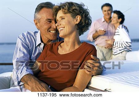 Stock Photography - people, smiling, couple, Middle-aged, enjoying, Caucasian, Mid-aged recreational sports. Fotosearch