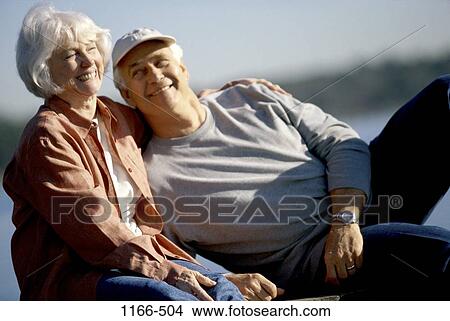 people, smiling, couple, senior, laughing, outdoors, cap View Large Photo Image Picture - people, smiling, couple, senior, laughing, outdoors, cap. Fotosearch