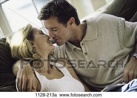 people, smiling, couple, window, sitting, couch View Large Photo Image Stock Image - people, smiling, couple, window, sitting, couch. Fotosearch
